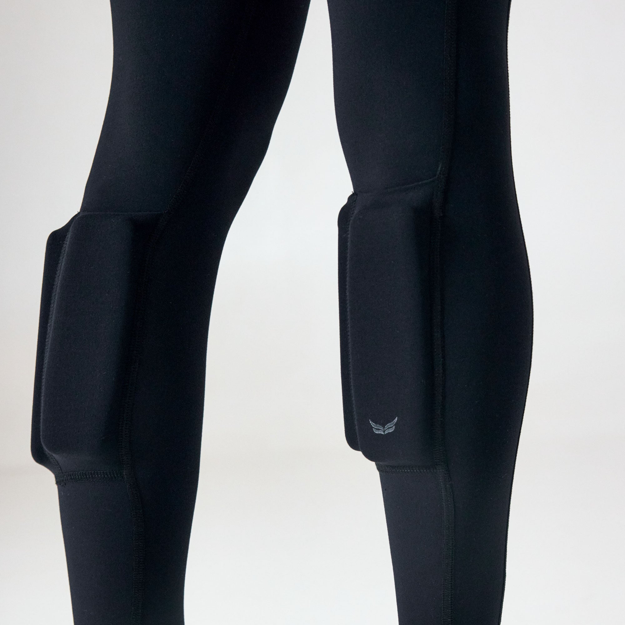 Close-up of the external calf weight pockets on black PTP Pace Microweighted Leggings.