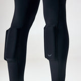Close-up of the external calf weight pockets on black PTP Pace Microweighted Leggings.