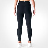 Front view of a woman wearing black PTP Pace Microweighted Leggings with calf weight pockets.