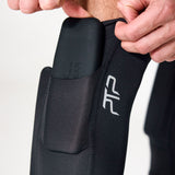 Close-up of a removable pocket weight being inserted into a PTP Motion Microweighted Calf Sleeve.