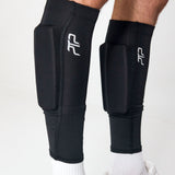 Close-up of black PTP Motion Microweighted Calf Sleeves worn on both legs.